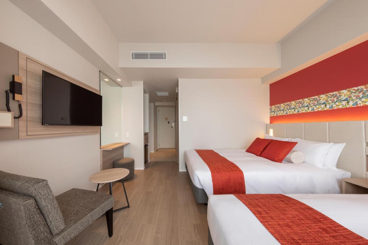Quadruple Room (1 Double Bed + 1 Single Bed + 1 Extra Bed)