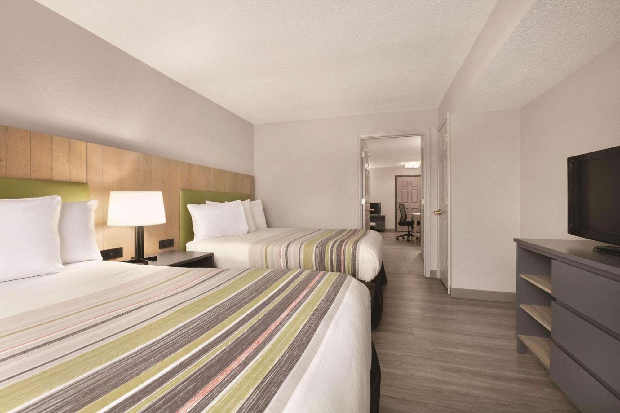 Two Queen Beds Suite with Sofa Bed