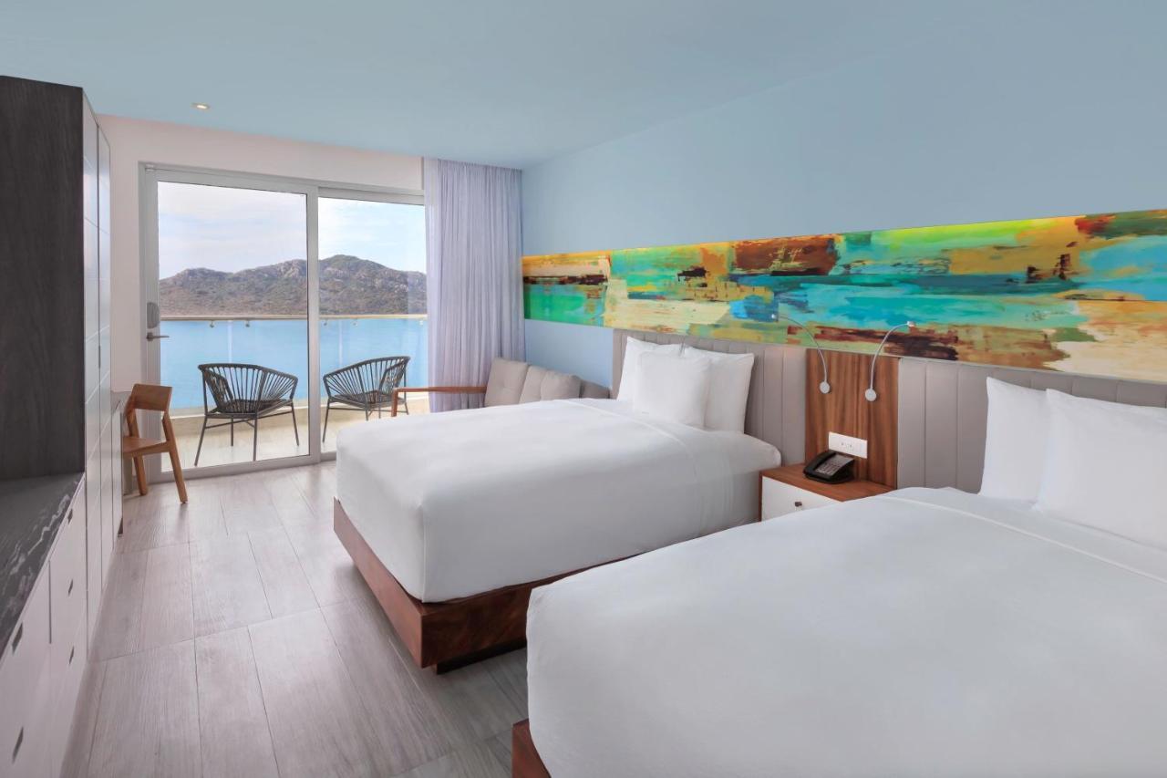 Deluxe Queen Room with Two Queen Beds, Balcony and Ocean View