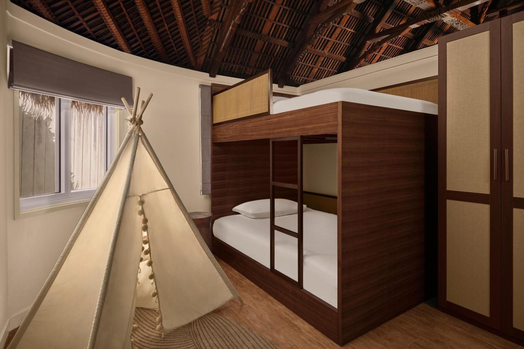 Family Room with Single Bunk Bed and One King Bed and Pool View