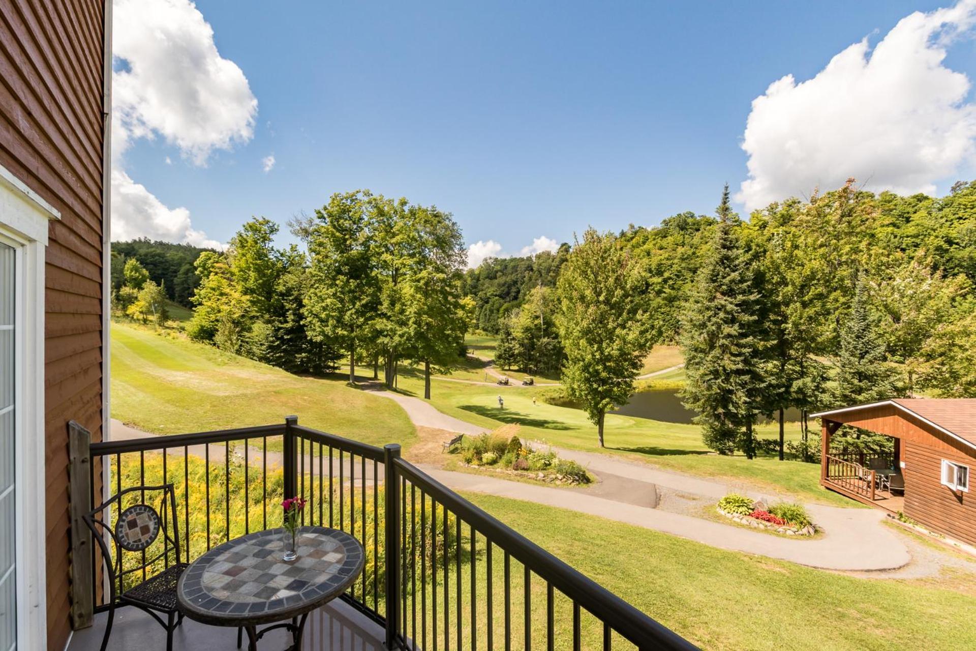 Three-Bedroom Condominium with Balcony and Fireplace - Golf View