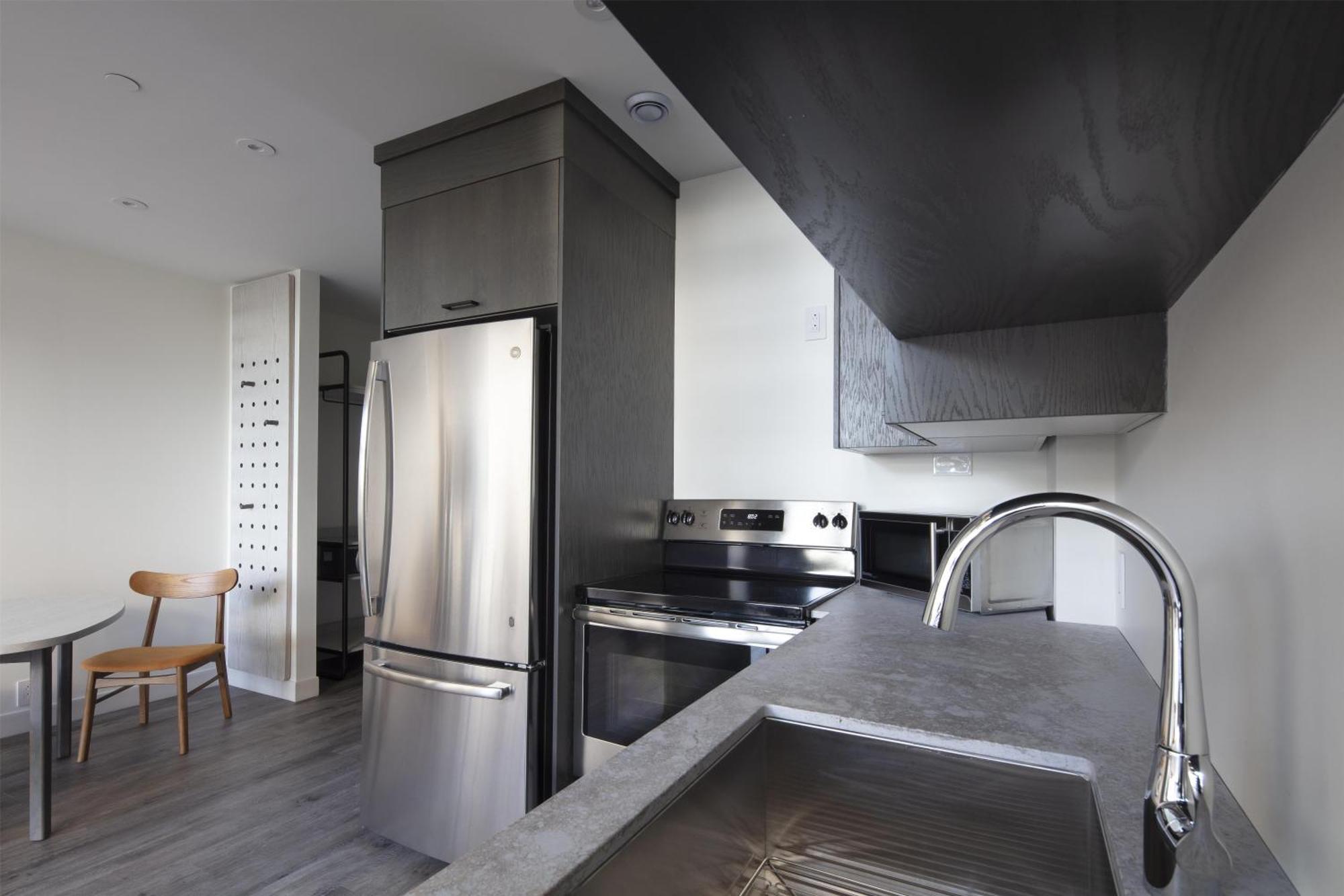 Two-Level King Suite with Balcony and Kitchen