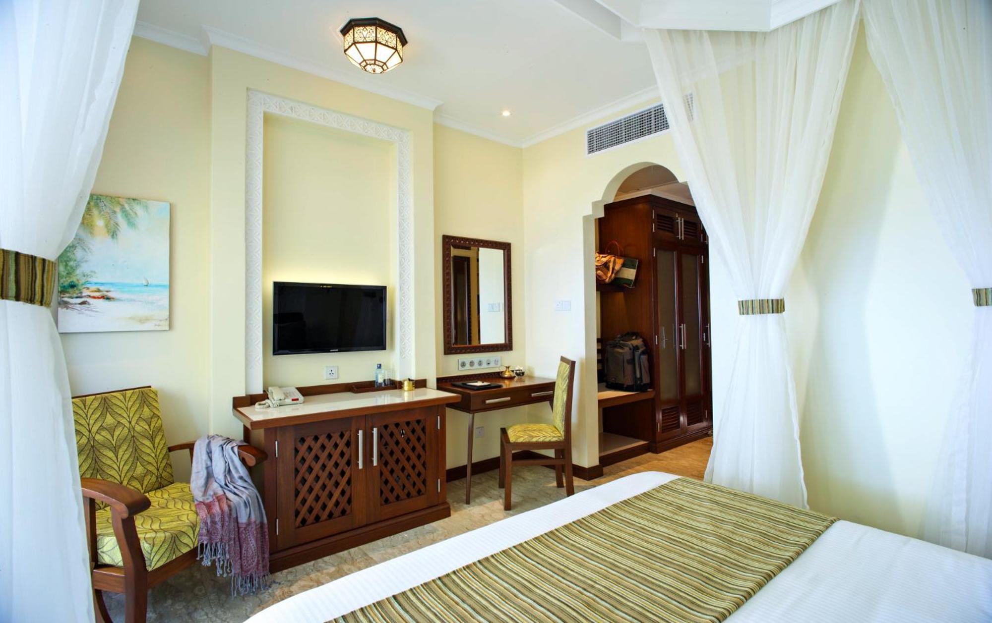 Kamer met Queensize Bed en Uitzicht op Zee